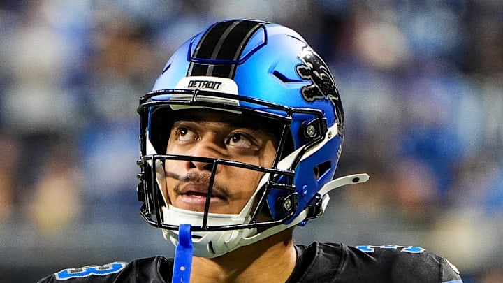 Detroit Lions running back Sione Vaki (33) looks on at warm ups before the Seattle Seahawks game at Ford Field 