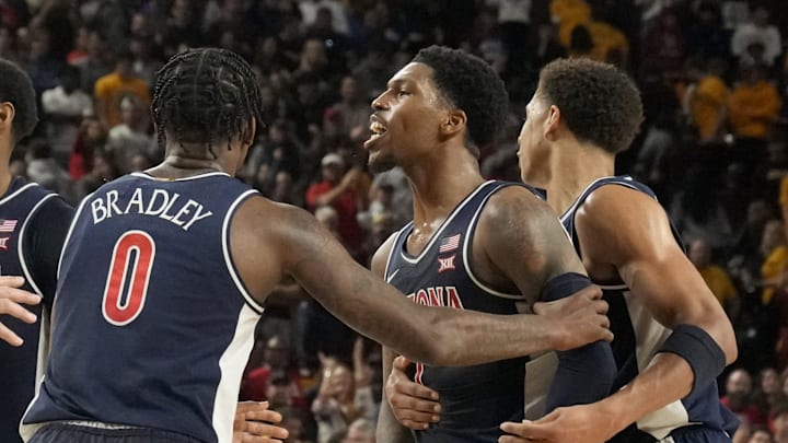 Arizona Wildcats guard Caleb Love (1) is held back by teammates during a Big 12 men's basketball game at Desert Financial Arena on Feb. 1, 2025. Both Arizona State Sun Devils guard BJ Freeman (10) and Love were ejected from the game. Arizona Wildcats guard Caleb Love (1) is held back by teammates during a Big 12 men's basketball game at Desert Financial Arena on Feb. 1, 2025. Both Arizona State Sun Devils guard BJ Freeman (10) and Love were ejected from the game.