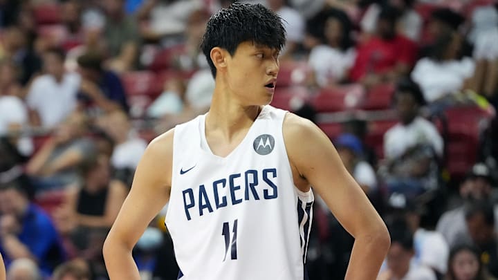 Jul 17, 2022; Las Vegas, NV, USA; Phoenix Suns forward Kevin Zhang (17) lines up next to Indiana Pacers forward Fanbo Zeng (11) during an NBA Summer League game at Thomas & Mack Center. Mandatory Credit: Stephen R. Sylvanie-Imagn Images