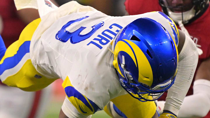 Nov 23, 2025; Inglewood, California, USA; Los Angeles Rams safety Kam Curl (3) leaps over Tampa Bay Buccaneers quarterback Teddy Bridgewater (10) as he is sacked by linebacker Byron Young (0) in the second half at SoFi Stadium. Mandatory Credit: Jayne Kamin-Oncea-Imagn Images