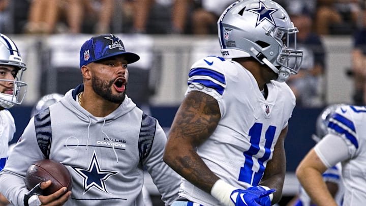 Dallas Cowboys quarterback Dak Prescott encourages Micah Parsons before a game against the Cincinnati Bengals.