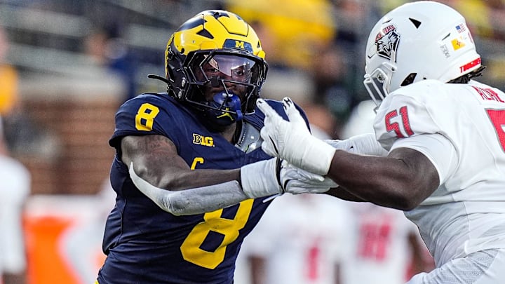 Michigan edge Derrick Moore (8) goes against New Mexico offensive lineman Malik Aliane (51)