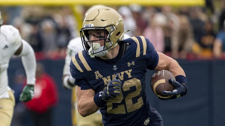 Nov 15, 2025; Annapolis, Maryland, USA;  Navy Midshipmen running back Eli Heidenreich (22) runs after a catch during the second half against the South Florida Bulls at Navy-Marine Corps Memorial Stadium. Navy Midshipmen defeated South Florida Bulls 41-28. Mandatory Credit: Tommy Gilligan-Imagn Images