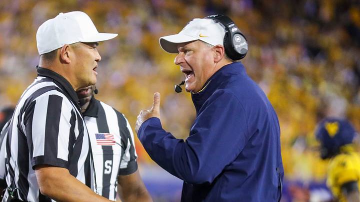 Sep 26, 2026; Morgantown, West Virginia, USA; West Virginia Mountaineers head coach Rich Rodriguez argues a call during the first quarter against the Oklahoma State Cowboys at Milan Puskar Stadium. Mandatory Credit: Ben Queen-Imagn Images Sep 26, 2026; Morgantown, West Virginia, USA; West Virginia Mountaineers head coach Rich Rodriguez argues a call during the first quarter against the Oklahoma State Cowboys at Milan Puskar Stadium. Mandatory Credit: Ben Queen-Imagn Images