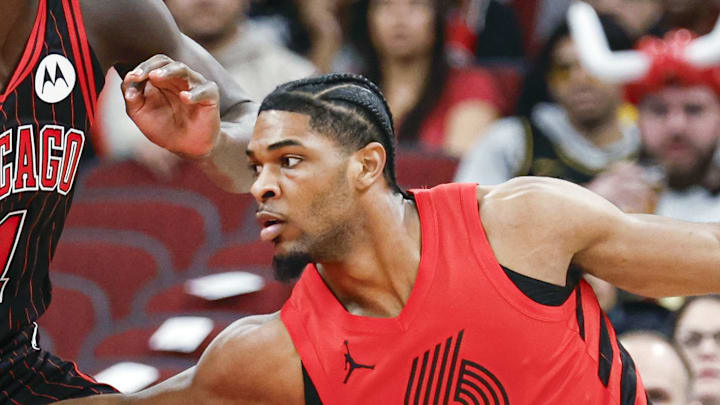 Chicago Bulls forward Leonard Miller defends against Portland Trail Blazers guard Scoot Henderson.