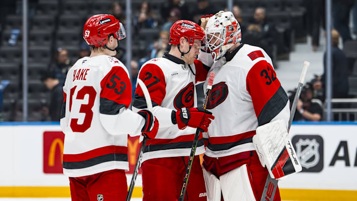 Mar 4, 2026; Vancouver, British Columbia, CAN; Carolina Hurricanes forward Jackson Blake (53) and forward Nikolaj Ehlers (27) and goalie Brandon Bussi (32) celebrate their victory against the Vancouver Canucks at Rogers Arena. Mandatory Credit: Bob Frid-Imagn Images