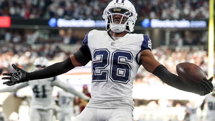 Dallas Cowboys CB Daron Bland carries the ball after an interception for a touchdown against the Washington Commanders. Dallas Cowboys CB Daron Bland carries the ball after an interception for a touchdown against the Washington Commanders.