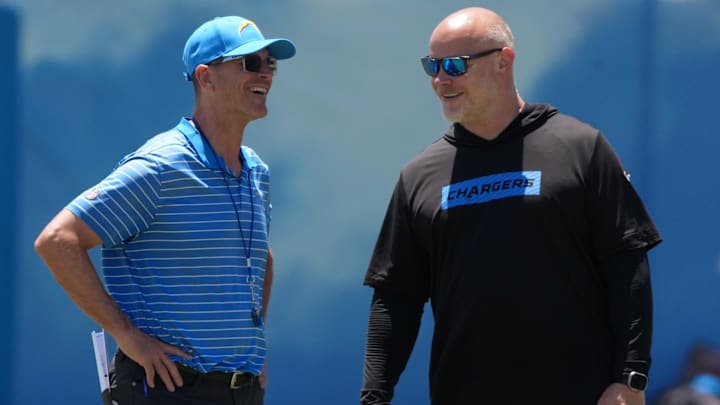 Jun 16, 2025; El Segundo, CA, USA; Los Angeles Chargers coach Jim Harbaugh (left) and executive director of player performance Ben Herbert during organized team activities at The Bolt. Mandatory Credit: Kirby Lee-Imagn Images