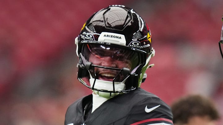 Arizona Cardinals quarterback Kyler Murray (1) chats with teammate Michael Wilson (14) before their game against the Tennessee Titans at State Farm Stadium in Glendale on Oct. 5, 2025.
