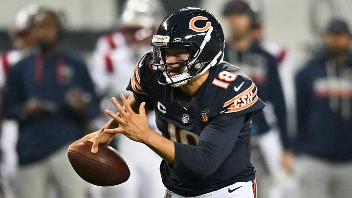 Chicago Bears quarterback Caleb Williams (18) runs the ball