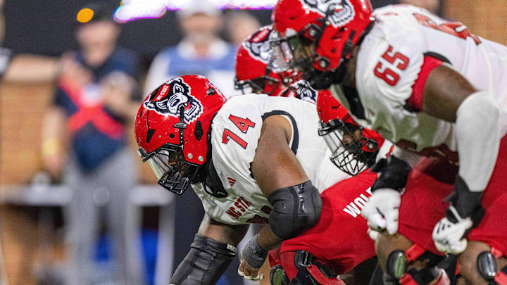 Sep 11, 2025; Winston-Salem, North Carolina, USA; North Carolina State Wolfpack offensive lineman Jalen Grant (74) snaps the ball against against the Wake Forest Demon Deacons in second half at Allegacy Federal Credit Union Stadium. Mandatory Credit: Luke Jamroz-Imagn Images Sep 11, 2025; Winston-Salem, North Carolina, USA; North Carolina State Wolfpack offensive lineman Jalen Grant (74) snaps the ball against against the Wake Forest Demon Deacons in second half at Allegacy Federal Credit Union Stadium. Mandatory Credit: Luke Jamroz-Imagn Images