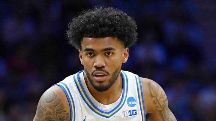 Mar 20, 2026; Philadelphia, PA, USA; UCLA Bruins guard Donovan Dent (2) dribbles the ball against UCF Knights guard Chris Johnson (22) in the first half during a first round game of the men's 2026 NCAA Tournament at Xfinity Mobile Arena. Mandatory Credit: Kyle Ross-Imagn Images Mar 20, 2026; Philadelphia, PA, USA; UCLA Bruins guard Donovan Dent (2) dribbles the ball against UCF Knights guard Chris Johnson (22) in the first half during a first round game of the men's 2026 NCAA Tournament at Xfinity Mobile Arena. Mandatory Credit: Kyle Ross-Imagn Images