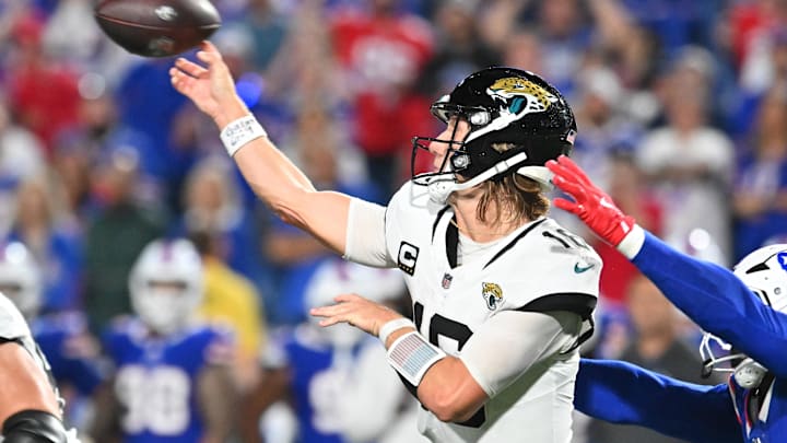 Sep 23, 2024; Orchard Park, New York, USA; Jacksonville Jaguars quarterback Trevor Lawrence (16) throws a pass under pressure by Buffalo Bills linebacker Von Miller (40) in the fourth quarter at Highmark Stadium. Mandatory Credit: Mark Konezny-Imagn Images