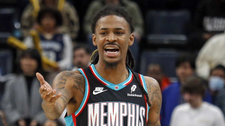 Dec 30, 2025; Memphis, Tennessee, USA; Memphis Grizzlies guard Ja Morant (12) reacts toward an official during the fourth quarter against the Philadelphia 76ers at FedExForum. Mandatory Credit: Petre Thomas-Imagn Images
