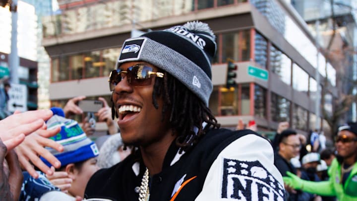 Seattle Seahawks wide receiver Rashid Shaheed high-fives fans