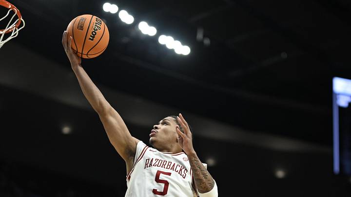 Mar 21, 2026; Portland, OR, USA; Arkansas Razorbacks guard Darius Acuff Jr. (5) shoots against High Point Panthers forward Cam'ron Fletcher (11) in the second half during a second round game of the men's 2026 NCAA Tournament at Moda Center. Mandatory Credit: Troy Wayrynen-Imagn Images