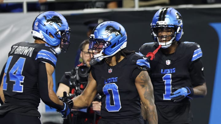 Detroit Lions running back Jahmyr Gibbs (0) celebrates a touchdown with wide receiver Amon-Ra St. Brown (14) Detroit Lions running back Jahmyr Gibbs (0) celebrates a touchdown with wide receiver Amon-Ra St. Brown (14)