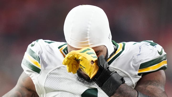 Green Bay Packers defensive end Micah Parsons (1) walks off the field after suffering a torn ACL at Denver.