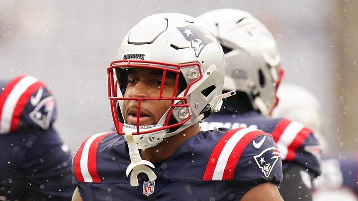 Dec 14, 2025; Foxborough, Massachusetts, USA; New England Patriots running back Treveyon Henderson (32) greets players during warm up before the start of the game against the Buffalo Bills at Gillette Stadium. Mandatory Credit: David Butler II-Imagn Images