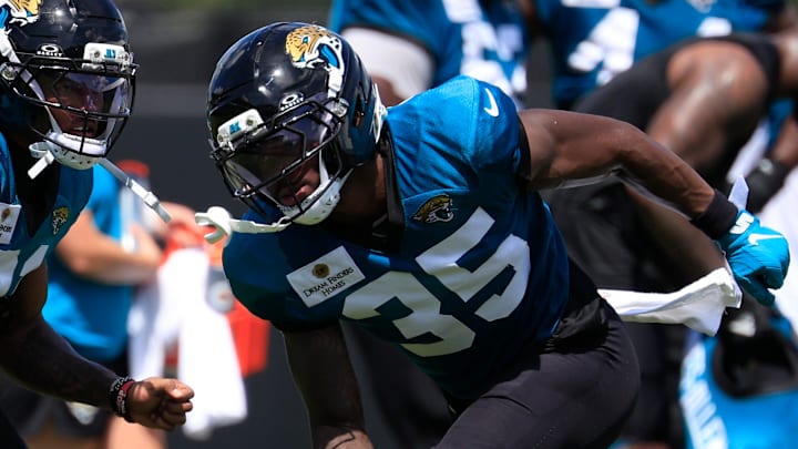 Jacksonville Jaguars cornerback Christian Braswell (21), left, and cornerback Doneiko Slaughter (35) drill after an NFL training camp session at the Miller Electric Center, Thursday, Aug. 14, 2025 in Jacksonville, Fla.