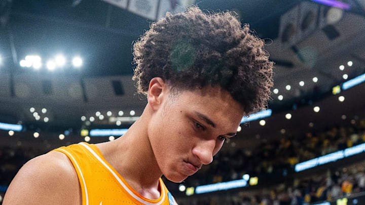 Tennessee forward Nate Ament (10) walks off the court as Michigan players celebrate their Final Four berth behind him after an NCAA Tournament Elite 8 game between Tennessee and Michigan at the United Center in Chicago on March 29, 2026.