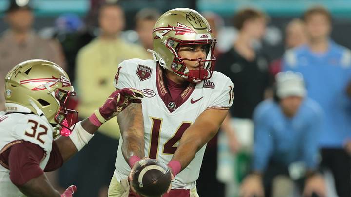Oct 17, 2026; Miami Gardens, Florida, USA; Florida State Seminoles quarterback Ashton Daniels (14) hands off to running back Ousmane Kromah (32) during the first half against the Miami Hurricanes at Hard Rock Stadium. Mandatory Credit: Sam Navarro-Imagn Images Oct 17, 2026; Miami Gardens, Florida, USA; Florida State Seminoles quarterback Ashton Daniels (14) hands off to running back Ousmane Kromah (32) during the first half against the Miami Hurricanes at Hard Rock Stadium. Mandatory Credit: Sam Navarro-Imagn Images