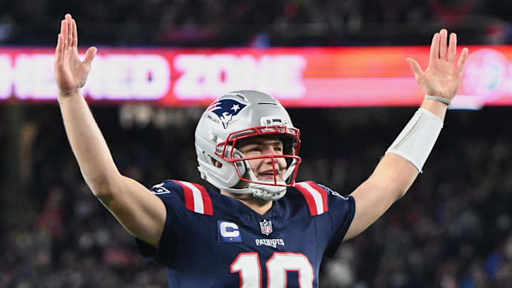 Jan 4, 2026; Foxborough, Massachusetts, USA; New England Patriots quarterback Drake Maye (10) reacts to a Patriots touchdown scored against the Miami Dolphins during the first quarter at Gillette Stadium. Mandatory Credit: Brian Fluharty-Imagn Images