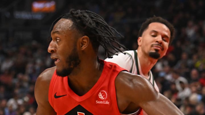 Toronto Raptors guard Immanuel Quickley dribbles against the Milwaukee Bucks. Toronto Raptors guard Immanuel Quickley dribbles against the Milwaukee Bucks.
