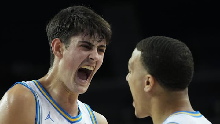 Dec 3, 2024; Los Angeles, California, USA; UCLA Bruins center Aday Mara (15) celebrates with guard Kobe Johnson (0) in the first half against the Washington Huskies at Pauley Pavilion presented by Wescom. Mandatory Credit: Kirby Lee-Imagn Images