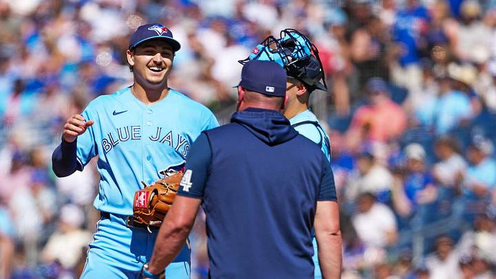 Aug 15, 2026; Toronto, Ontario, CAN; Toronto Blue Jays relief pitcher Ricky Tiedemann (33) is  relieved by manager John Schneider (14) against the New York Yankees during the third inning at Rogers Centre. Mandatory Credit: Nick Turchiaro-Imagn Images