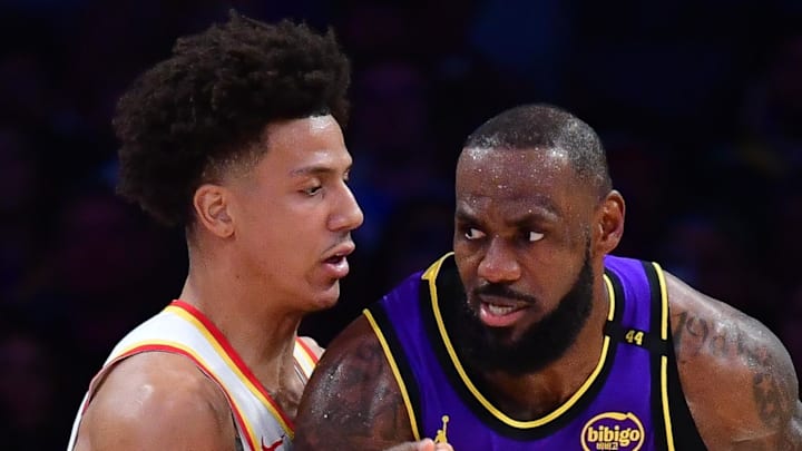 Los Angeles Lakers forward LeBron James moves the ball against Atlanta Hawks forward Jalen Johnson during the first half