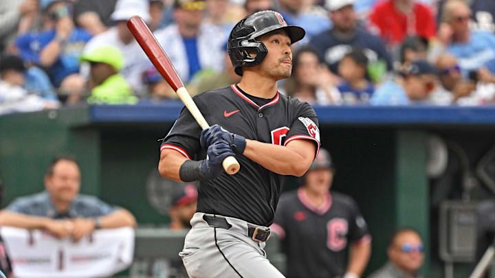 Mar 29, 2025; Kansas City, Missouri, USA; Cleveland Guardians left fielder Steven Kwan (38) hits a solo home run in the fifth inning against the Kansas City Royals at Kauffman Stadium. Mandatory Credit: Peter Aiken-Imagn Images