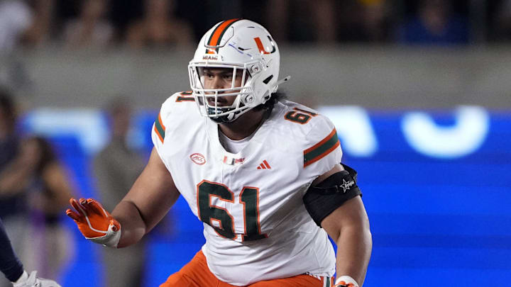 Oct 5, 2024; Berkeley, California, USA; Miami Hurricanes offensive lineman Francis Mauigoa (61) blocks against California Golden Bears linebacker David Reese (7) during the first quarter at California Memorial Stadium. Mandatory Credit: Darren Yamashita-Imagn Images Oct 5, 2024; Berkeley, California, USA; Miami Hurricanes offensive lineman Francis Mauigoa (61) blocks against California Golden Bears linebacker David Reese (7) during the first quarter at California Memorial Stadium. Mandatory Credit: Darren Yamashita-Imagn Images