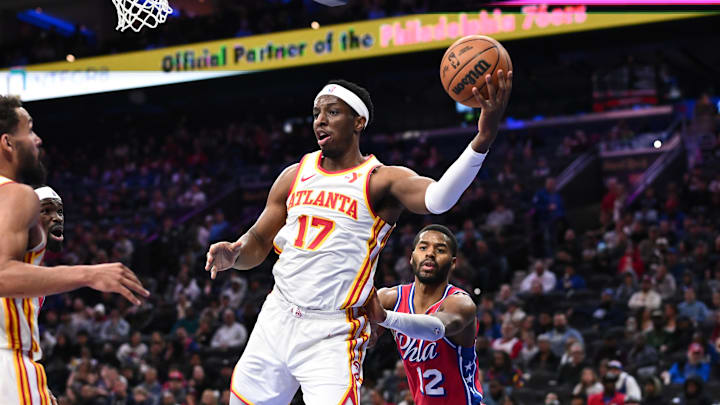 Atlanta Hawks forward Onyeka Okongwu secures a rebound against the Philadelphia 76ers
