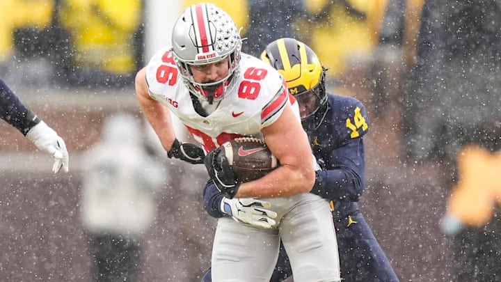 Ohio State tight end Max Klare (86) makes a catch against Michigan defensive back Jordan Young (14) during the second half at Michigan Stadium in Ann Arbor on Saturday, Nov. 29, 2025.