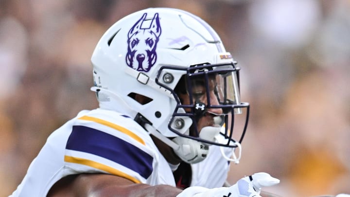Aug 30, 2025; Iowa City, Iowa, USA; Iowa Hawkeyes running back Kamari Moulton (28) runs the ball as Albany Great Danes defensive back Cam Stodghill (1) and defensive back Denzel Patrick (2) make the tackle during the first quarter at Kinnick Stadium.