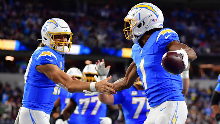 Nov 17, 2024; Inglewood, California, USA;  Los Angeles Chargers wide receiver Quentin Johnston (1) celebrates his touchdown scored against the against the Cincinnati Bengals with quarterback Justin Herbert (10) during the first half at SoFi Stadium. Mandatory Credit: Gary A. Vasquez-Imagn Images