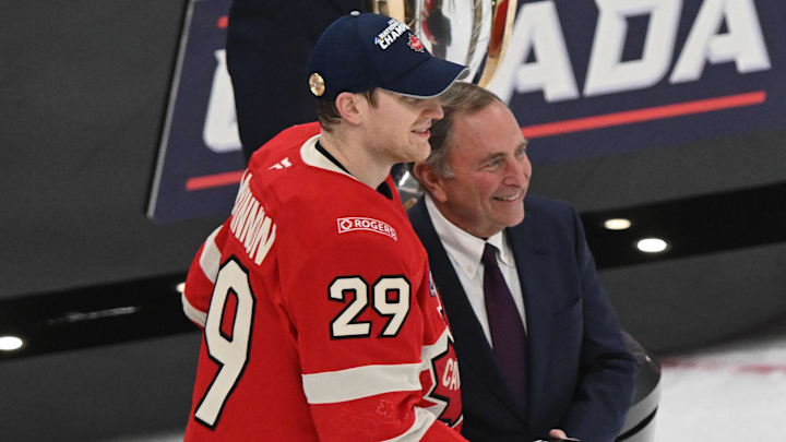 Feb 20, 2025; Boston, MA, USA; [Imagn Images direct customers only]  Team Canada forward Nathan MacKinnon (29) receives the Most Valuable Player award from NHL commissioner Gary Bettman after the win against Team USA during the 4 Nations Face-Off ice hockey championship game at TD Garden. Mandatory Credit: Brian Fluharty-Imagn Images