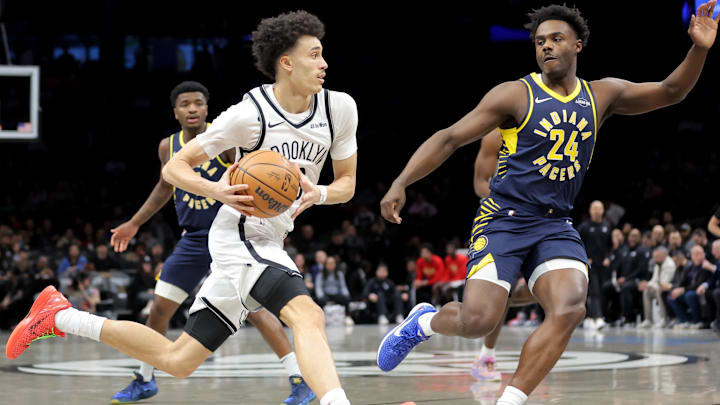 Feb 11, 2026; Brooklyn, New York, USA; Brooklyn Nets guard Nolan Traore (88) drives to the basket against Indiana Pacers guard Kobe Brown (24) during the first quarter at Barclays Center. Mandatory Credit: Brad Penner-Imagn Images