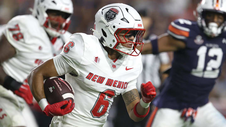 Sep 14, 2024; Auburn, Alabama, USA; New Mexico Lobos running back Eli Sanders (6) carries against the Auburn Tigers during the second quarter at Jordan-Hare Stadium. Mandatory Credit: John Reed-Imagn Images