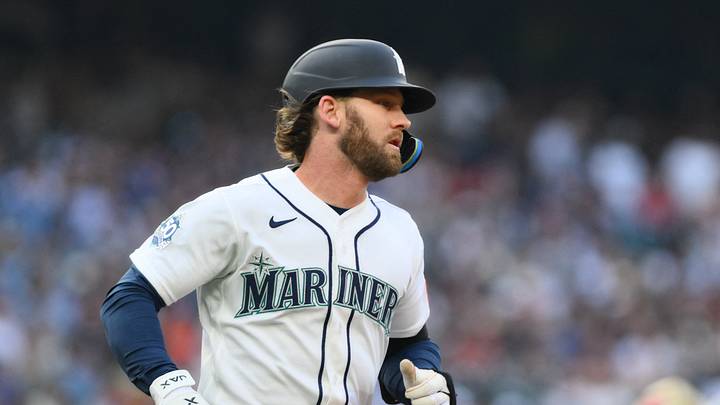 Seattle, Washington, USA; Seattle Mariners designated hitter Taylor Ward (27) runs towards first base after hitting a single against the Detroit Tigers during the third inning at T-Mobile Park. Mandatory Credit: Steven Bisig-Imagn Images