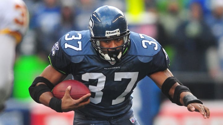 Jan. 5, 2008; Seattle, WA, USA; Seattle Seahawks running back Shaun Alexander (37) rushes the ball against the Washington Redskins during the NFC wild card game at Qwest Field. Seattle defeated Washington 35-14.