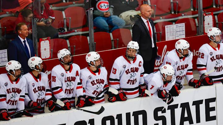 St. Cloud State hockey coach Brett Larson stands behind the Husky bench during the opening game of the season against St. Thomas on Oct. 4, 2025 at the Herb Brooks National Hockey Center. SCSU lost 4-3. St. Cloud State hockey coach Brett Larson stands behind the Husky bench during the opening game of the season against St. Thomas on Oct. 4, 2025 at the Herb Brooks National Hockey Center. SCSU lost 4-3.