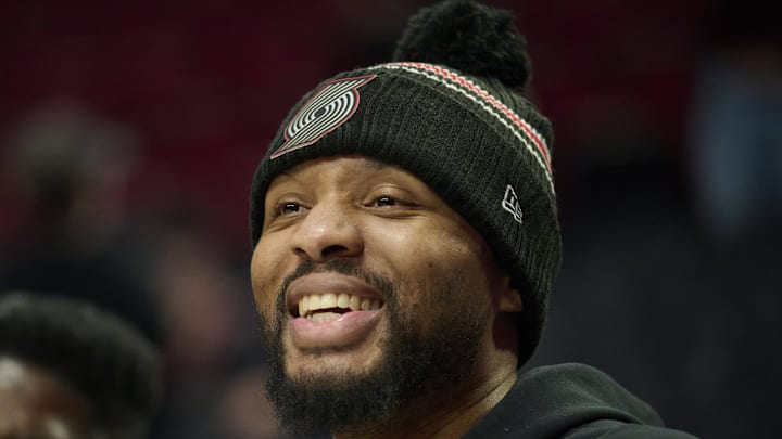 Nov 30, 2025; Portland, Oregon, USA; Portland Trail Blazers guard Damian Lillard (0) shares a laugh before a game against the Oklahoma City Thunder at Moda Center. Mandatory Credit: Troy Wayrynen-Imagn Images