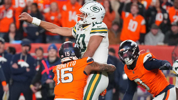 Dec 14, 2025; Denver, Colorado, USA; Green Bay Packers quarterback Jordan Love (10) is tackled by Denver Broncos linebacker Nik Bonitto (15) while throwing downfield during the fourth quarter at Empower Field at Mile High. Dec 14, 2025; Denver, Colorado, USA; Green Bay Packers quarterback Jordan Love (10) is tackled by Denver Broncos linebacker Nik Bonitto (15) while throwing downfield during the fourth quarter at Empower Field at Mile High.