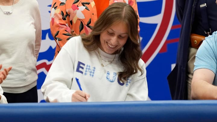 Elisa Boozer signs for the rifle team at the University of Kentucky during signing day at Moore High School in Moore, Okla., Wednesday, Nov. 13, 2024.