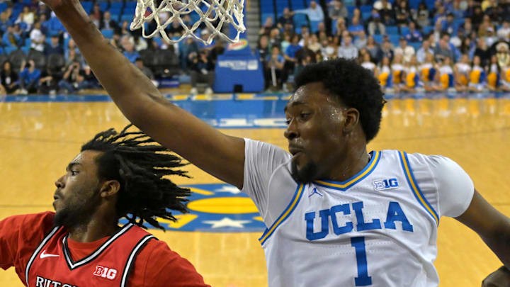 Feb 3, 2026; Los Angeles, California, USA;  Rutgers Scarlet Knights forward Bryce Dortch (4) beats UCLA Bruins forward Xavier Booker (1) to a rebound in the first half at Pauley Pavilion presented by Wescom Financial. Mandatory Credit: Jayne Kamin-Oncea-Imagn Images