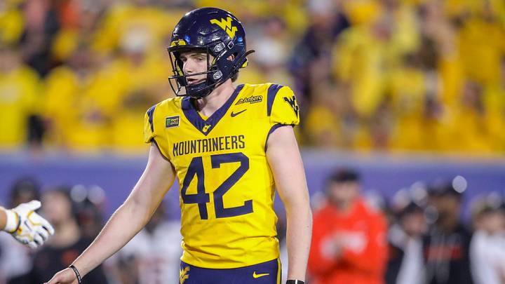 Sep 26, 2026; Morgantown, West Virginia, USA; West Virginia Mountaineers kicker Jack Cassidy (42) kicks a field goal during the fourth quarter against the Oklahoma State Cowboys at Milan Puskar Stadium. Mandatory Credit: Ben Queen-Imagn Images