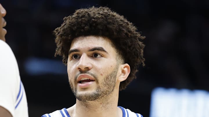 Mar 29, 2026; Washington, DC, USA; Duke Blue Devils forward Cameron Boozer (12) talks to Blue Devils center Patrick Ngongba (21) during a stoppage in play against the UConn Huskies in the second half during an Elite Eight game of the East Regional of the men's 2026 NCAA Tournament at Capital One Arena. Mandatory Credit: Amber Searls-Imagn Images