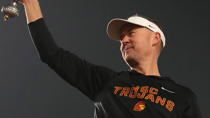 Nov 29, 2025; Los Angeles, California, USA; Southern California Trojans head coach Lincoln Riley leads the Spirit of Troy marching band in a rendition of Tribute to Troy after teh game against the UCLA Bruins at United Airlines Field at Los Angeles Memorial Coliseum. Mandatory Credit: Kirby Lee-Imagn Images Nov 29, 2025; Los Angeles, California, USA; Southern California Trojans head coach Lincoln Riley leads the Spirit of Troy marching band in a rendition of Tribute to Troy after teh game against the UCLA Bruins at United Airlines Field at Los Angeles Memorial Coliseum. Mandatory Credit: Kirby Lee-Imagn Images